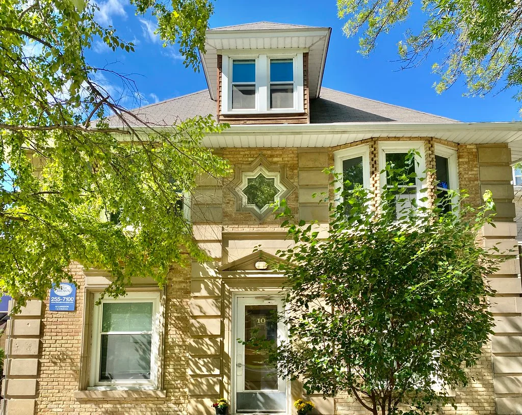 Facade of the Sophie and Charles Morgan House in Madison with a star-shaped window.