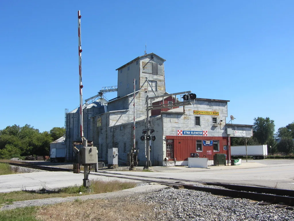 Etna Green grain elevator beside a railroad crossing.