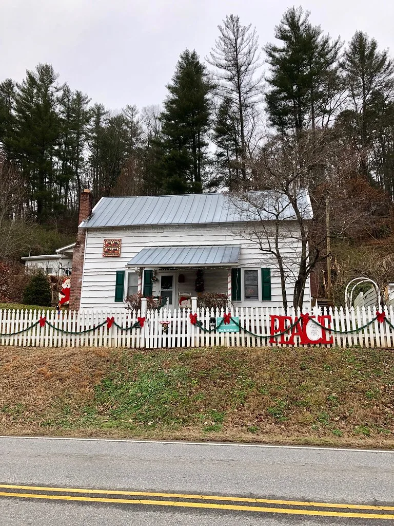 Shular-Messer House in Dillsboro with a porch and white fence.