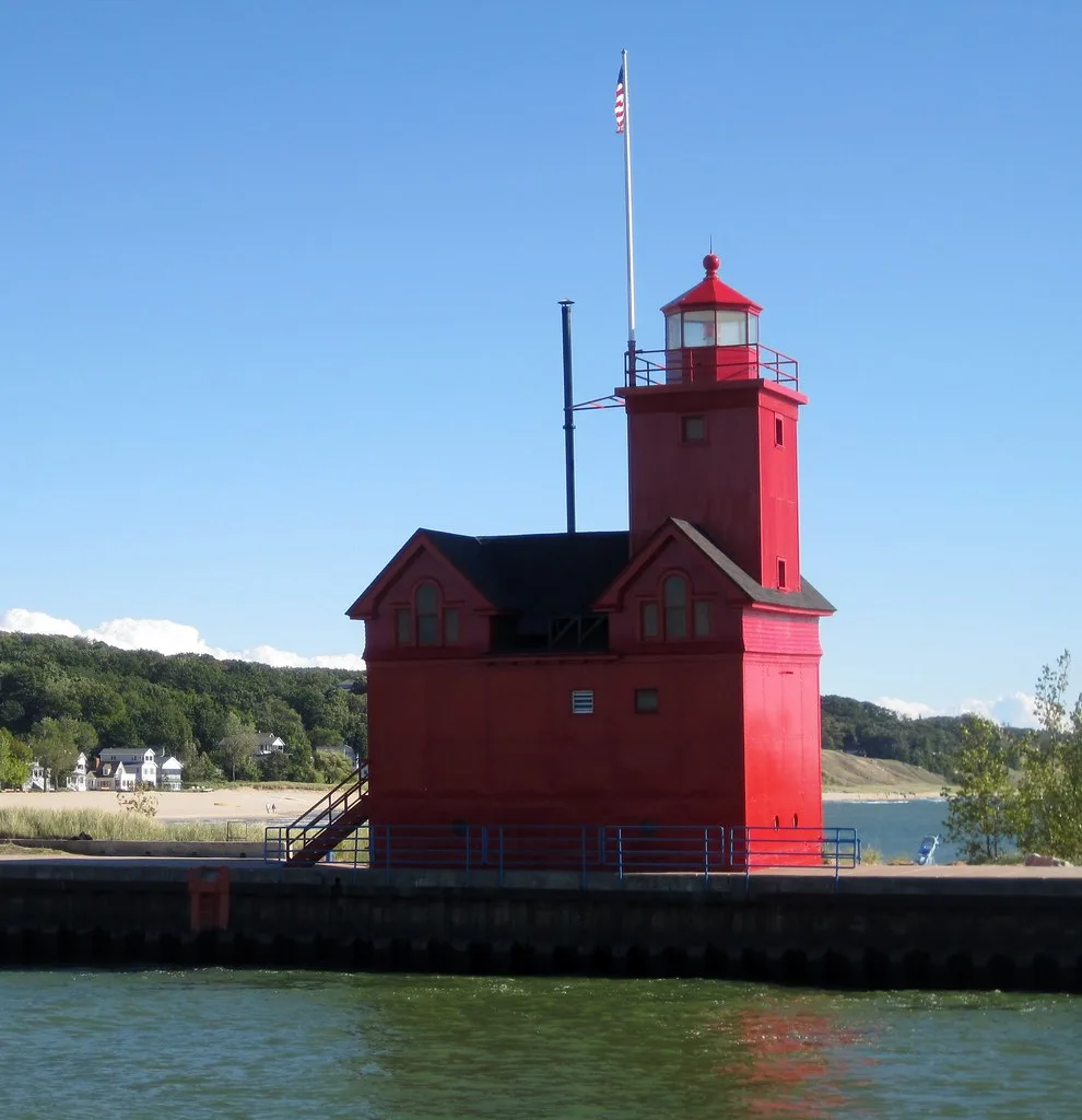 Red Holland Harbor Lighthouse viewed from the water.