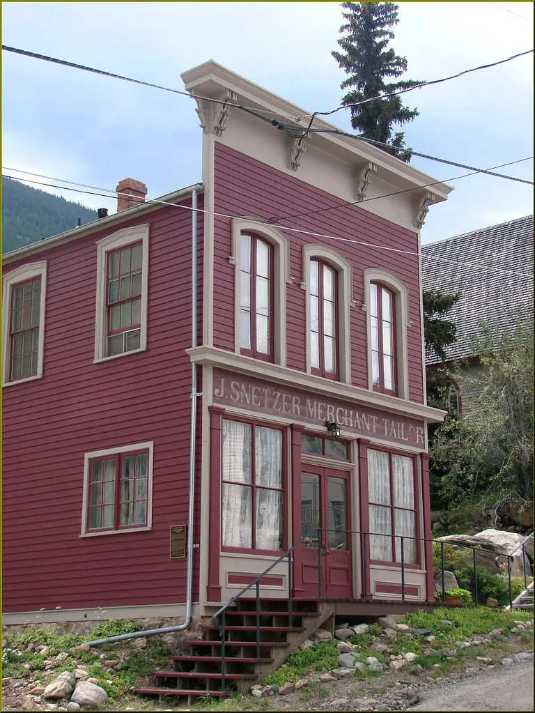Two-storey red facade of the former J. Snetzer shop in Georgetown.