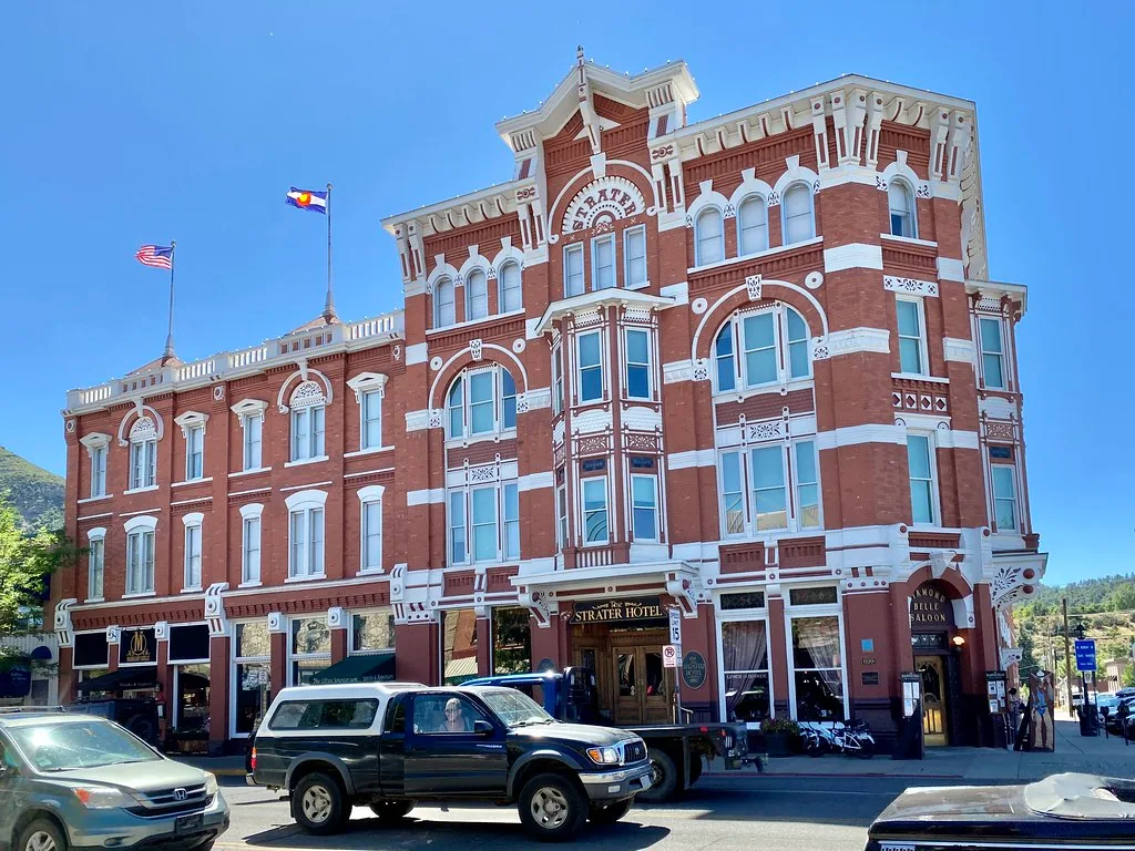 Red and white facade of the Strater Hotel in Durango.