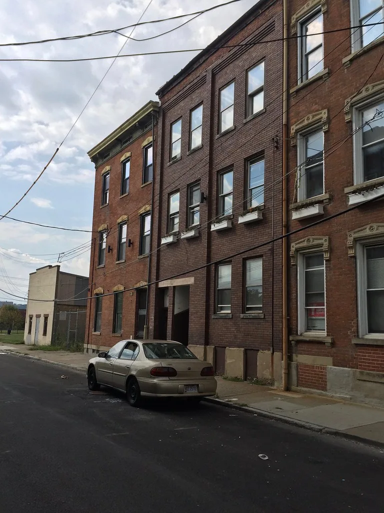 Older brick buildings on Wade Street in Cincinnati's West End.