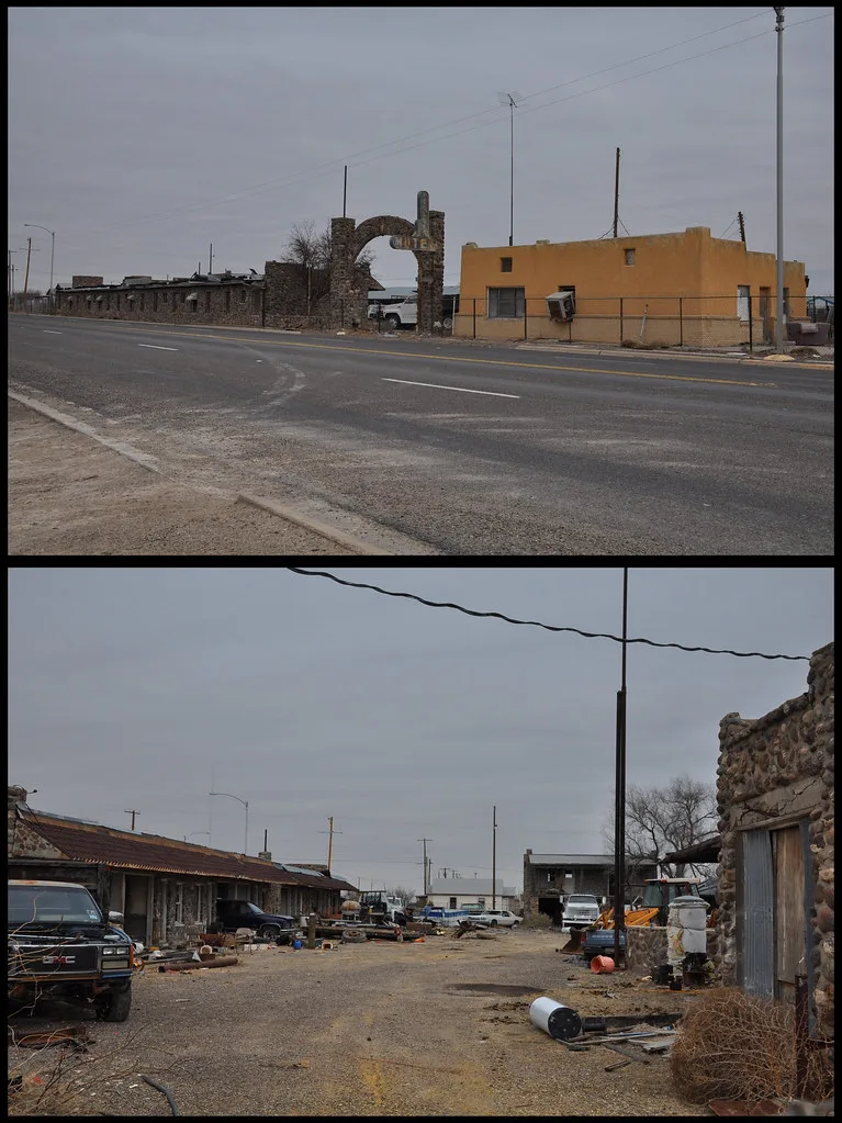 Two views of a former stone motel and stored vehicles.