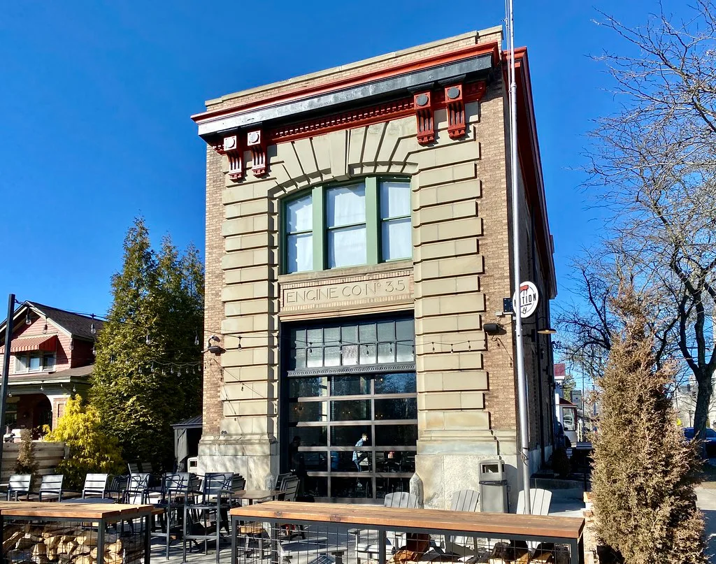 Facade of former fire station number 35 in Cincinnati, repurposed with an outdoor terrace.