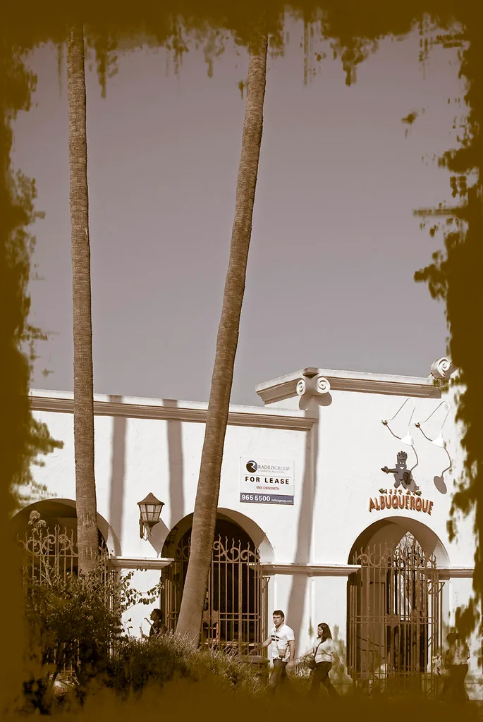 Arched façade of a former restaurant offered for lease.
