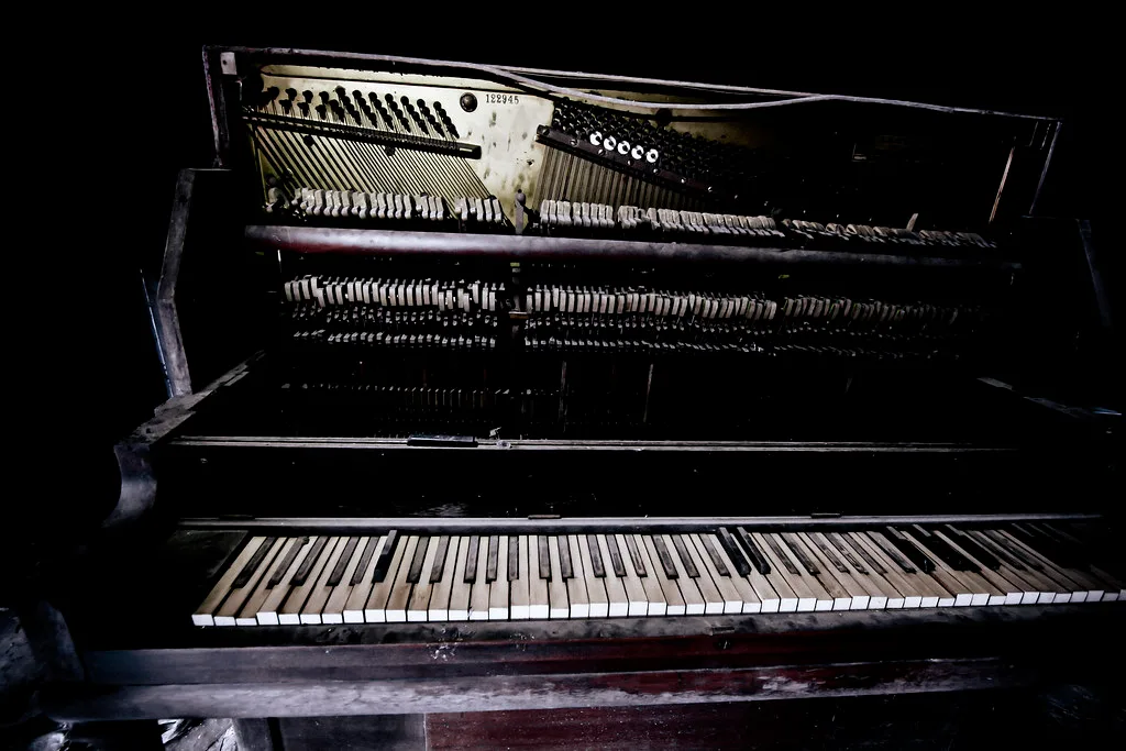 Damaged piano inside the former Stonewall Jackson Training School