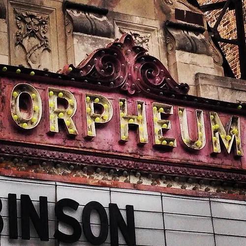 Weathered Orpheum theatre marquee and facade ornament