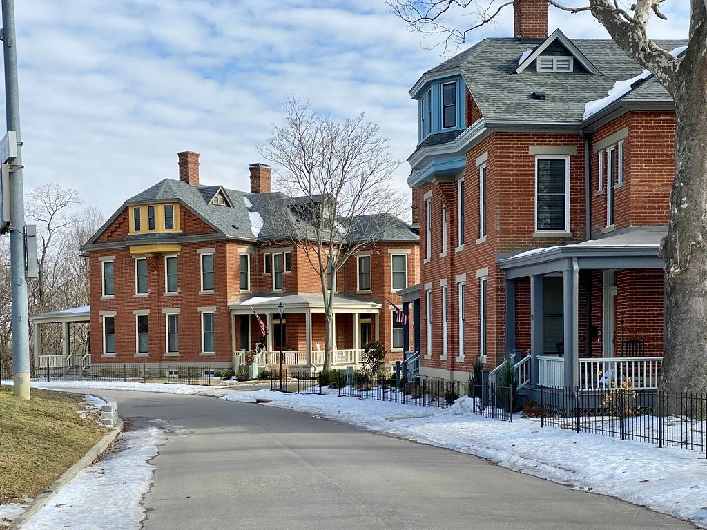 Brick houses on Alexander Circle in Fort Thomas, bordered by snow.