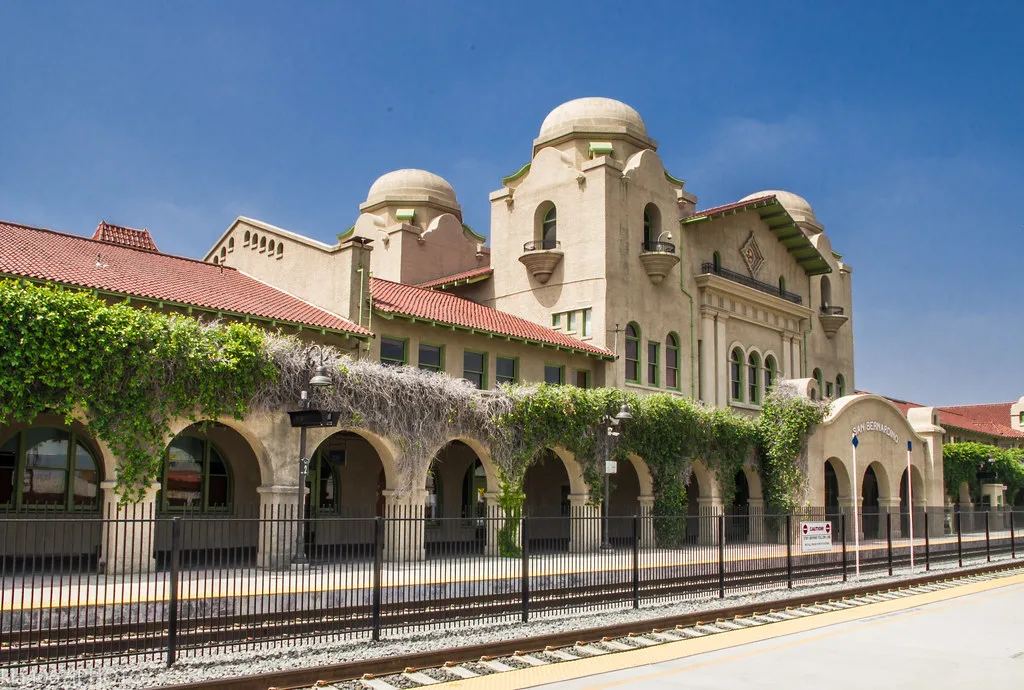 San Bernardino station with arcades, towers and red-tiled roofs.