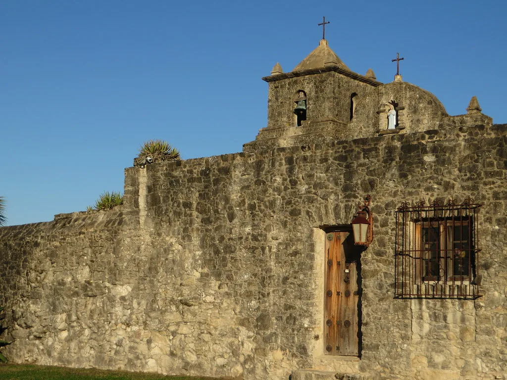 Stone façade and bell gables of Presidio La Bahía in Goliad