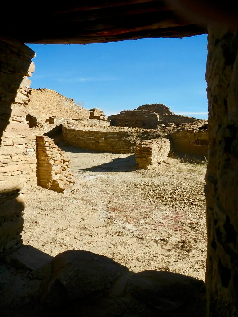 Ruined stone walls seen through an old opening.