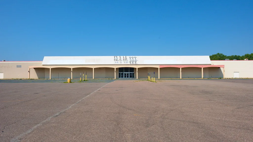 Former Kmart store in Saint Paul's North End facing a large empty parking lot.