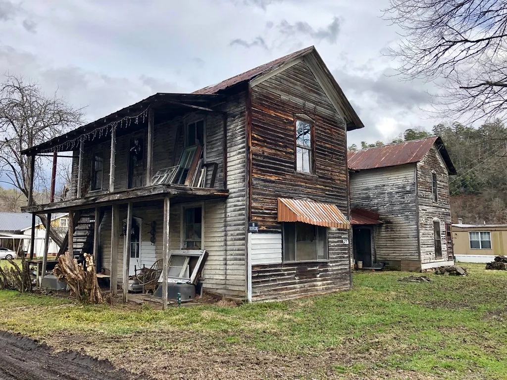 Old wooden hotel with weathered galleries and siding.