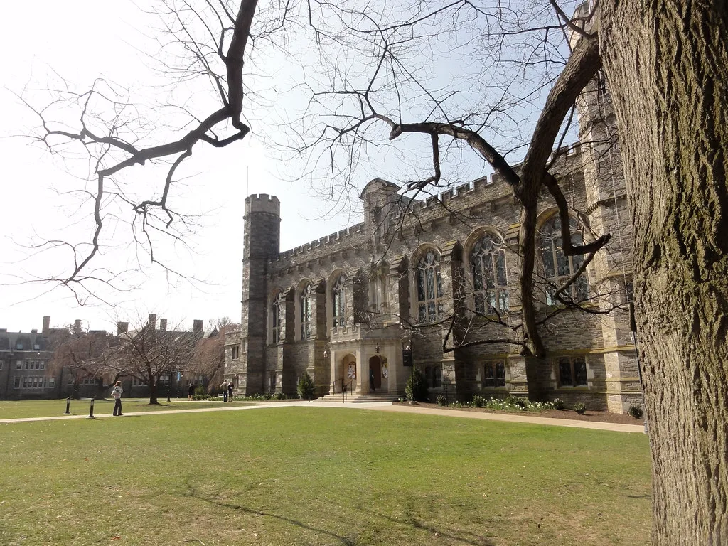 Crenellated facade and windows of Thomas Great Hall viewed from the lawn.
