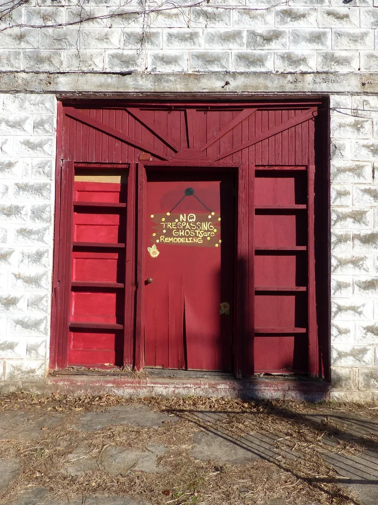 Red doorway and masonry of an old building in Calico Rock