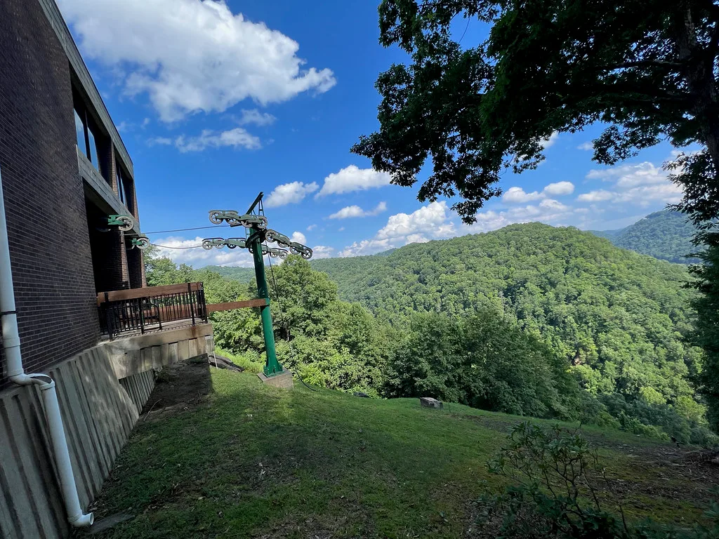 Former aerial tramway support at Hawks Nest above a wooded valley.